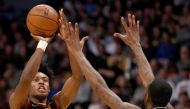 Collin Sexton #2 of the Cleveland Cavaliers puts up a shot against Will Barton III #5 of the Denver Nuggets in the fourth quarter at the Pepsi Center on January 11, 2020 in Denver, Colorado. Matthew Stockman/AFP 