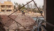 Members of the Syrian Civil Defence, also known as the White Helmets, dig through the rubble of a building, hit by airstrikes, in the town of Baleh, in the western countryside of the northern province of Aleppo on January 18, 2020. / AFP / Aaref WATAD