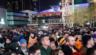 Mourners gather in Microsoft Square near the Staples Center to pay respects to Kobe Bryant after a helicopter crash killed the retired basketball star, in Los Angeles, California, U.S., January 26, 2020. REUTERS/Kyle Grillot