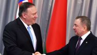 US Secretary of State Mike Pompeo and Belarus' Foreign Minister Vladimir Makei shake hands during a joint news conference in Minsk on February 1, 2020. / AFP / Sergei GAPON