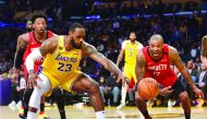 Los Angeles Lakers forward LeBron James (23) plays for the ball against Houston Rockets forward P.J. Tucker (17) during the second half at Staples Center. Mandatory Credit: Gary A. Vasquez-USA TODAY Sports
