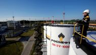 A worker is seen at the central processing facility of the Rosneft-owned Priobskoye oil field outside the West Siberian city of Nefteyugansk, Russia, August 4, 2016. Reuters / Sergei Karpukhin 