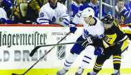 Toronto Maple Leafs left wing Pierre Engvall (47) skates with the puck against pressure from Pittsburgh Penguins center Sidney Crosby (87) during the third period at PPG PAINTS Arena. Pittsburgh won 5-2. Credit: Charles LeClaire-USA TODAY Sports
