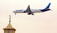 (FILES) In this file photo taken on March 13, 2019, a Kuwait Airways Boeing B777 aircraft prepares to land at Kuwait International Airport in Kuwait City. AFP / Yasser Al-Zayyat