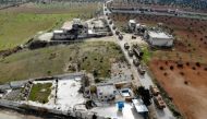 An aerial view taken on February 22, 2020 shows a Turkish military convoy that crossed into the Syrian territory via the Kafr Lusin border, passing near Syria's northwestern city of Idlib and heading toward the south of the Idlib province. / AFP / Omar HA