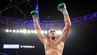 Tyson Fury celebrates after knocking down Deontay Wilder during their Heavyweight bout for Wilder's WBC and Fury's lineal heavyweight title on February 22, 2020 at MGM Grand Garden Arena in Las Vegas, Nevada. Al Bello/Getty Images/AFP