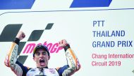 Repsol Honda Team's Spanish rider Marc Marquez celebrating on the podium after winning the MotoGP race at the Thailand Grand Prix in this file photo taken on October 6, 2019. AFP / Lillian Suwanrumpha
