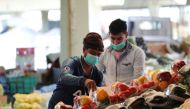 Men wear protective face masks at a market after Saudi Arabia imposed a temporary lockdown on the province of Qatif following the spread of coronavirus, in Qatif, Saudi Arabia March 9, 2020. Reuters