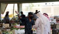 A man wearing a protective face mask sells fruit at a market, after Saudi Arabia imposed a temporary lockdown on the province of Qatif following the spread of coronavirus, in Qatif, Saudi Arabia March 9, 2020. Reuters
 