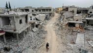 This picture taken on March 12, 2020 shows an aerial view of the town of Afis, which has sustained widespread destruction due to heavy fighting and air-strikes by pro-Syrian regime forces, in the northwestern Idlib province. / AFP / Omar HAJ KADOUR