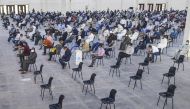 Kuwait - MARCH 12: People wait at the fairground which has become a health center for coronavirus testing in kuwait City on March 12, 2020. T. ( Jaber Abdulkhaleg - Anadolu Agency )
