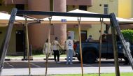 Red Crescent members deliver meals for isolated people following coronavirus disease (COVID-19) outbreak at Khairan Resort, used as a quarantine centre, in Khairan, Kuwait March 19, 2020. Reuters/Stephanie McGehee