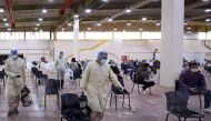 Expatriate returning from Egypt, Syria, and Lebanon arrive to be re-tested at a kuwaiti health ministry containment and screening zone for COVID-19 coronavirus disease in kuwait City on March 16, 2020. / AFP / YASSER AL-ZAYYAT