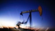 A long exposure image shows the movement of a crude oil pump jack in the Permian Basin in Loving County, Texas, November 23, 2019. Reuters/Angus Mordant
 
 
  