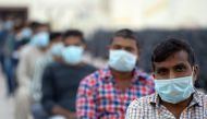 Expatriates wait their turn to be tested at a coronavirus testing centre at Kuwait International Fairgrounds in Mishref, Kuwait March 18, 2020. REUTERS/Stephanie McGehee