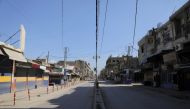 A view shows a closed shops along an empty street, as restrictions are imposed as measure to prevent the spread of the coronavirus disease (COVID-19) in Qamishli, Syria March 23, 2020. REUTERS/Rodi Said