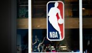 NBA logo is shown at the 5th Avenue NBA store in New York City.  AFP / Jeenah Moon