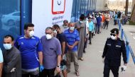 Citizens queue in front of markets in Kuwait City, Kuwait on May 9, 2020. Kuwait extended the curfew to May 30 as part of efforts to battle the novel coronavirus (Covid-19) pandemic. Faisal Yaser - Anadolu