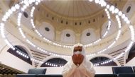 A Saudi man wearing a protective face mask performs the Al-Fajr prayer inside the Al-Rajhi Mosque, after the announcement of the easing of lockdown measures amid the coronavirus disease (COVID-19) outbreak, in Riyadh, Saudi Arabia May 31, 2020. REUTERS/Ah