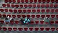 Fans sit with social distancing for an Australian Football League (AFL) match between the Port Adelaide Power and Adelaide Crows amidst the easing of the coronavirus disease (COVID-19) restrictions at Adelaide Oval in Adelaide, Australia, June 13, 2020. A