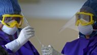 Representational picture of medical workers collecting a swab sample to test for the COVID-19 coronavirus. AFP / LAKRUWAN WANNIARACHCHI