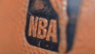 In this file photo taken on January 08, 2013 A detail view of the Spalding ball with NBA logo is seen during the game between the Orlando Magic and the Denver Nuggets at the Pepsi Center in Denver, Colorado. The NBA said July 13, 2020 two players have tes