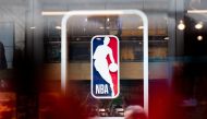 In this file photo taken on March 12, 2020, the NBA logo is shown at the 5th Avenue NBA store in New York City. The NBA reported zero positive COVID-19 cases for the fourth consecutive week on August 12, 2020, in the latest round of testing carried out at