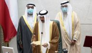 Kuwait Emir H H Sheikh Nawaf al-Ahmad al-Sabah holds a paper as he takes the oath of office at the parliament, in Kuwait City, Kuwait September 30, 2020. REUTERS/Stephanie McGehee