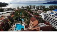 This aerial photo taken on October 1, 2020 shows empty swimming pools at a hotel on Patong beach in Phuket. AFP / Lillian Suwanrumpha 