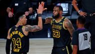 FILE PHOTO: Oct 2, 2020; Orlando, Florida, USA; Los Angeles Lakers forward LeBron James (23) celebrates with guard Danny Green (14) after a play during the third quarter against the Miami Heat in game two of the 2020 NBA Finals at AdventHealth Arena. REUT