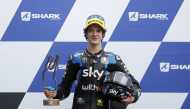 SKY Racing Team VR46's Celestino Vietti poses with a trophy on the podium as he celebrates after winning the Moto3 race. REUTERS/Stephane Mahe