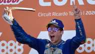 Suzuki Ecstar's Spanish rider Joan Mir celebrates on the podium after winning the MotoGP race of the European Grand Prix at the Ricardo Tormo circuit in Valencia on November 8, 2020. / AFP / JOSE JORDAN