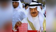 (FILES) In this file photo taken on October 23, 2010 Bahraini Prime Minister Khalifa bin Salman al-Khalifa casts his ballot at a polling station in Manama. AFP / ADAM JAN