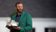 AUGUSTA, GEORGIA - NOVEMBER 15: Dustin Johnson of the United States poses with the Masters Trophy during the Green Jacket Ceremony after winning the Masters at Augusta National Golf Club on November 15, 2020 in Augusta, Georgia. Rob Carr/Getty Images/AFP
