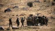 Israeli soldiers walk during a drill in the Israeli-controlled Golan Heights near the Israel-Syria frontier in August. Amir Cohen/Reuters