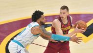 Miles Bridges #0 of the Charlotte Hornets guards Dylan Windler #9 of the Cleveland Cavaliers during the first quarter at Rocket Mortgage Fieldhouse on December 23, 2020 in Cleveland, Ohio. Jason Miller/Getty Images/AFP
