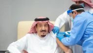 Saudi King gets a dose of a coronavirus disease vaccine in Neom, Saudi Arabia, January 8, 2021. Bandar Algaloud/Courtesy of Saudi Royal Court/Handout via Reuters 