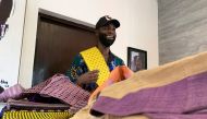 Fashion designer Tsemaye Binitie holds his custom Aso-Oke fabric during a workshop in Lagos, Nigeria February 8, 2021. Picture taken February 8, 2021. REUTERS/Nneka Chile