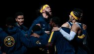 Denver Nuggets center JaVale McGee (34) with teammates before the game against the Memphis Grizzlies at Ball Arena. Isaiah J. Downing