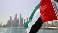 UAE flag flies over a boat at Dubai Marina, Dubai, United Arab Emirates. Reuters/Ahmed Jadallah