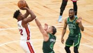 Miami Heat forward Jimmy Butler (22) scores against Boston Celtics guard Carsen Edwards (4) in the first quarter at TD Garden. David Butler