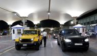 A customs officer checks cars of Saudi nationals as they enter Bahrain, after Saudi authorities lift the travel ban on its citizens after fourteen months due to Coronavirus (COVID-19) restrictions, at King Fahad Causeway, Bahrain, May 17, 2021. Reuters/Ha