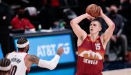 Denver Nuggets center Nikola Jokic (15) attempts a shot as Portland Trail Blazers forward Carmelo Anthony (00) defends in the first quarter during game two in the first round of the 2021 NBA Playoffs at Ball Arena. Isaiah J. Downing