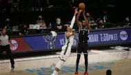 Brooklyn Nets power forward Kevin Durant (7) shoots a three point shot against Milwaukee Bucks power forward Giannis Antetokounmpo (34) during the third quarter of game one in the Eastern Conference semifinals of the 2021 NBA Playoffs at Barclays Center. 