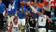 Los Angeles Clippers forward Kawhi Leonard (2) moves in for a basket against Dallas Mavericks center Kristaps Porzingis (6) and center Boban Marjanovic (51) during the second half in game seven of the first round of the 2021 NBA Playoffs. at Staples Cente