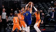 Denver Nuggets center Nikola Jokic (15) is defended by Phoenix Suns center Deandre Ayton (22) and forward Mikal Bridges (25) as guard Chris Paul (3) and forward Michael Porter Jr. (1) look on in the first quarter during game three in the second round of t