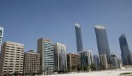 FILE PHOTO: An Emirati man wears a protective mask as he walks past buildings in Abu Dhabi, United Arab Emirates September 1, 2020. REUTERS/Nir Elias