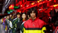 Models present outfits from luxury carmaker Ferrari's first internally-designed fashion collection for women and men as the first step of its rebooted brand extension strategy, in Maranello, Italy, June 13, 2021. REUTERS/Remo Casilli