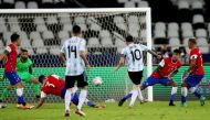 Argentina's Lionel Messi shoots at goal (REUTERS/Ricardo Moraes)