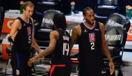 Los Angeles Clippers guard Luke Kennard (5) guard Terance Mann (14) and forward Kawhi Leonard (2) celebrate the 118-104 victory against the Utah Jazz in game four in the second round of the 2021 NBA Playoffs. at Staples Center. Mandatory Credit: Gary A. V